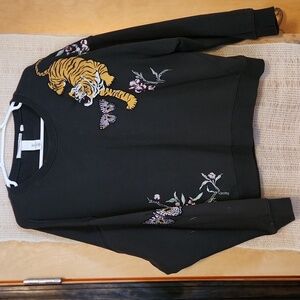 L.O.G.G. sweatshirt with embroidered design background is dark gray